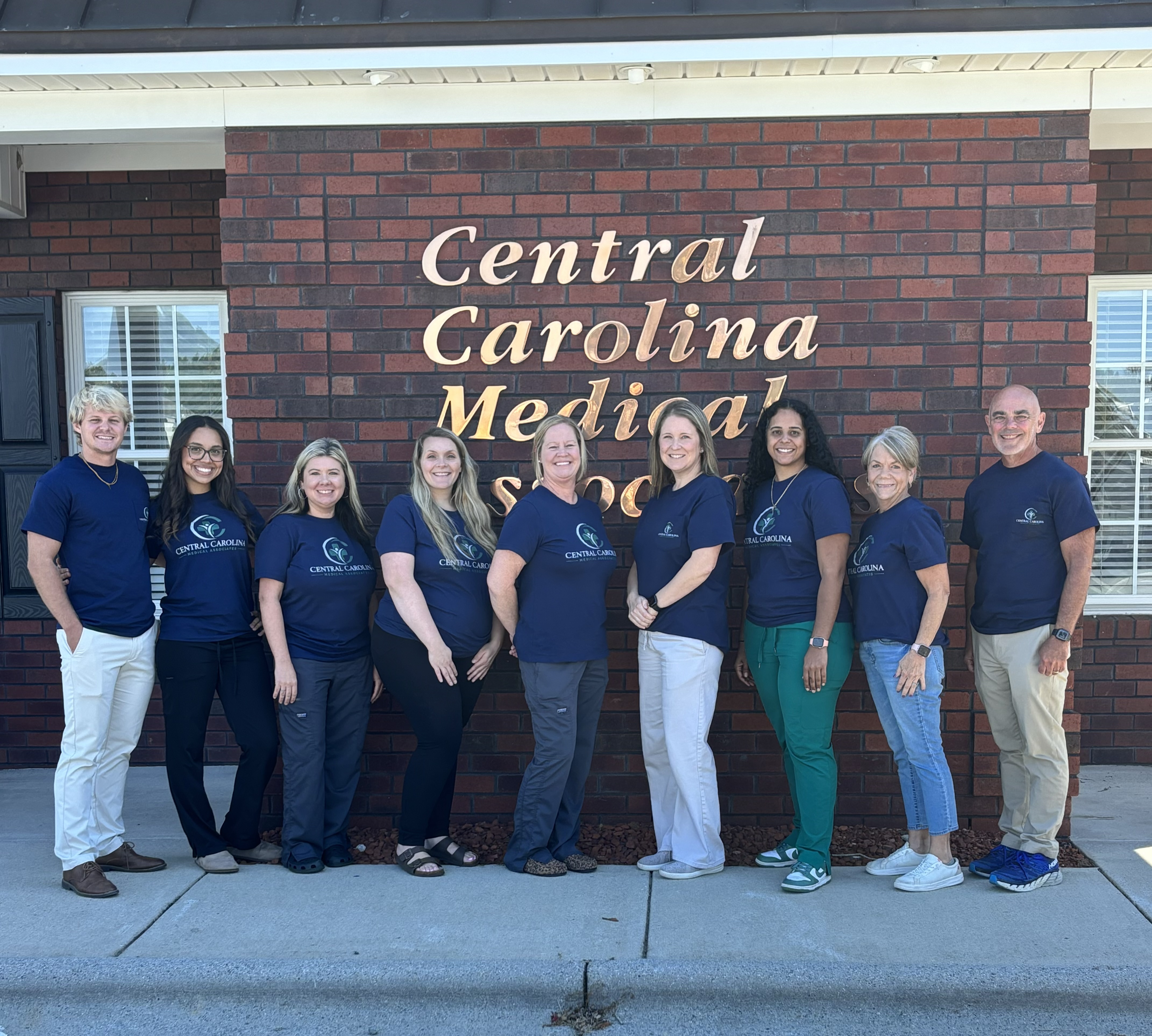 The Central Carolina Medical Associates team standing together outside the office